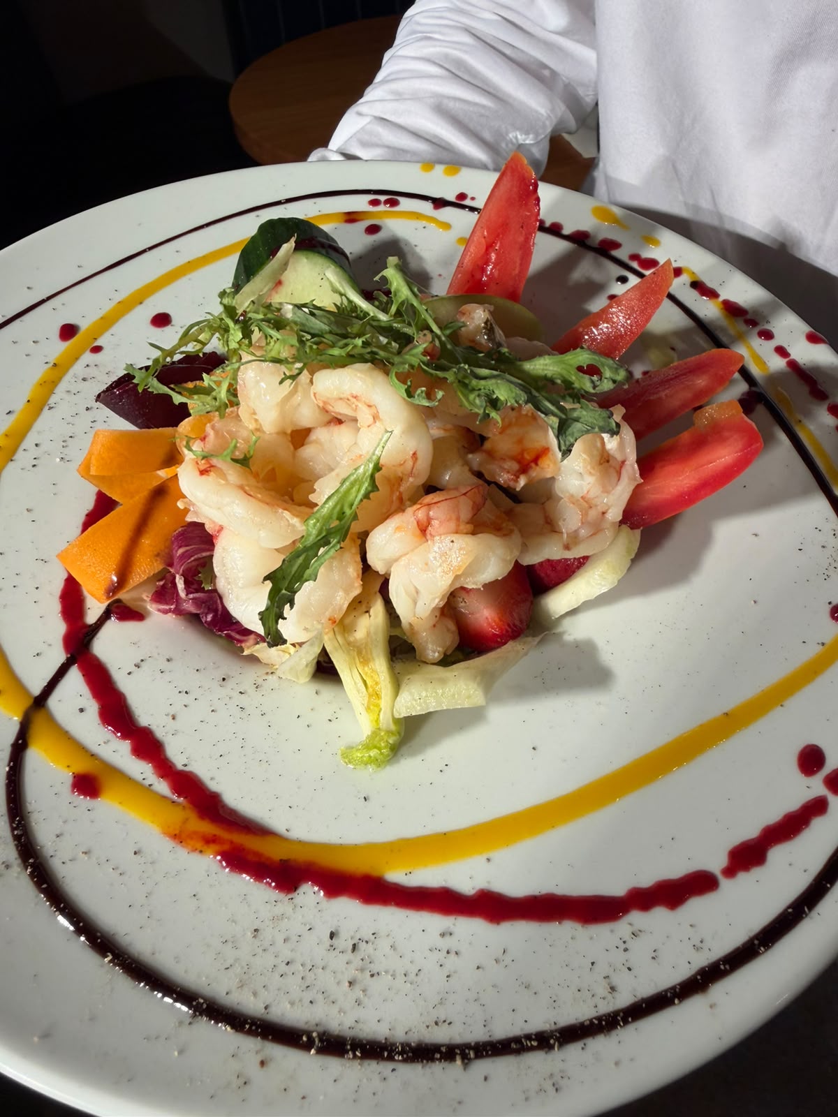 Gambas Insalata, pan-seared prawns with mixed leaves and citrus mustard dressing