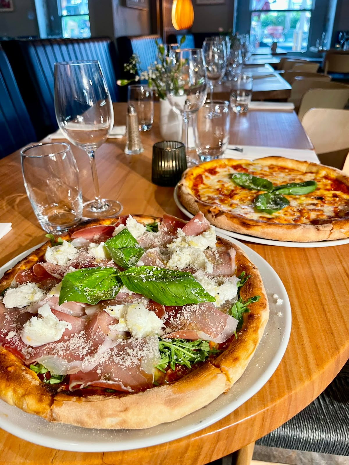 Wood-fired Primavera pizza with Parma ham, buffalo mozzarella and rocket